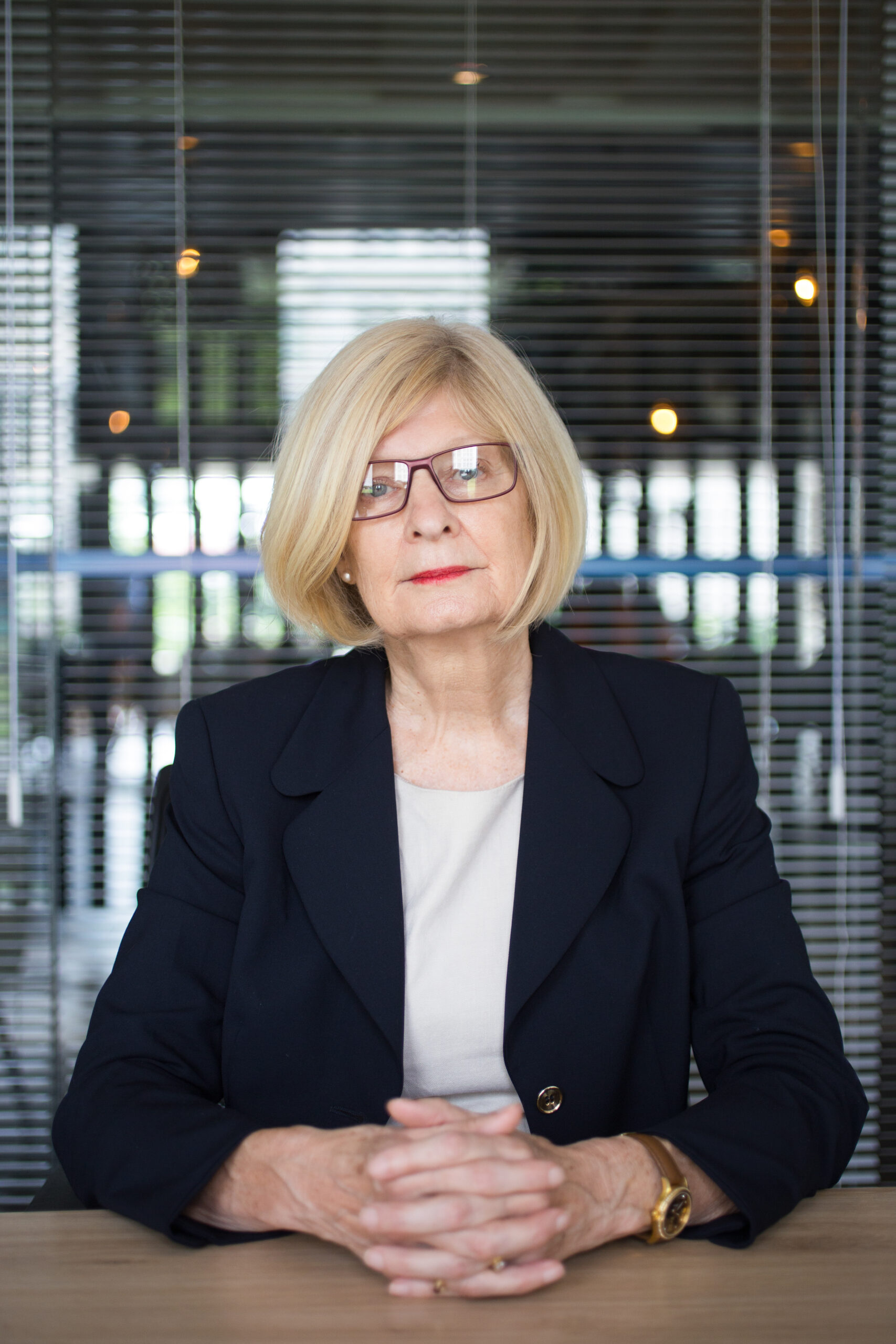 Serious Senior Business Woman at Office Desk